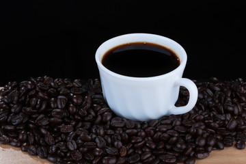 coffeebeans around white cup