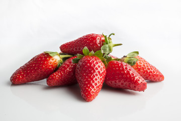 Bunch of ripe strawberries on white background view from above