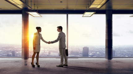 Obraz na płótnie Canvas Business partners handshake
