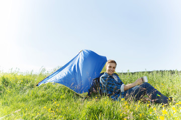 Woman hiker in summer forest