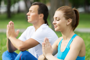 Having yoga practice in park