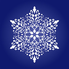 Die cut paper card with cutout mandala ornament. 