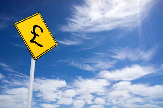 Currency concept: Pound on yellow road sign, clear blue sky back