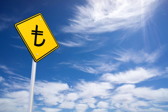 Yellow Road Sign with Turkish Lira Sign Inside on Blue Sky Backg