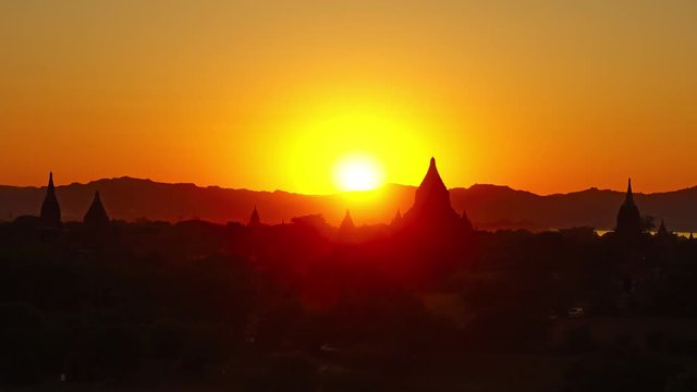 Silhouette of Temples in Bagan at sunset, Myanmar (Burma), zoom timelapse, 4k
