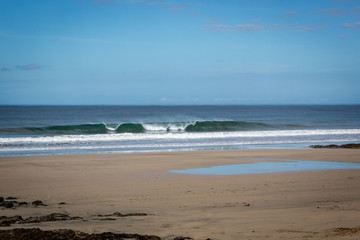 Empty beach in a blue sky day in Playa Negra, northern coast of Costa Rica