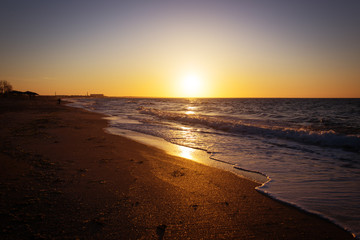 Beautiful sunset view and waves on the beach