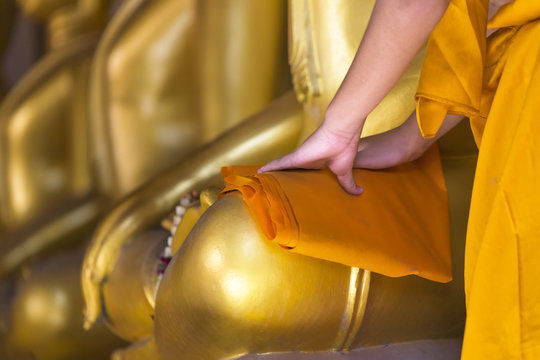 Cleaning Image of Buddha by Novice at Ayutthaya Historical Park