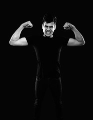 Fototapeta na wymiar young man showing his muscles 