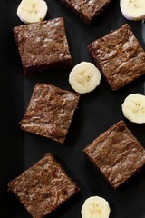 Banana chocolate Brownies on black background