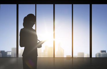 silhouette of business woman with tablet pc