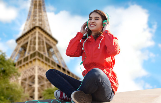 happy young woman in headphones listening to music
