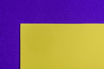 Eva foam ethylene vinyl acetate smooth lemon yellow surface on purple sponge plush background