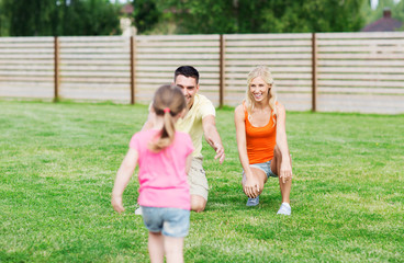 happy family playing outdoors