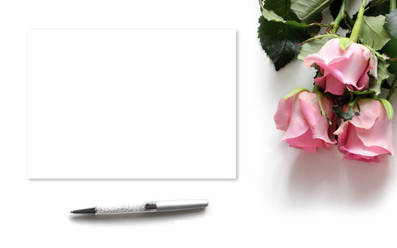 Mockup for presentations with roses, pen and paper