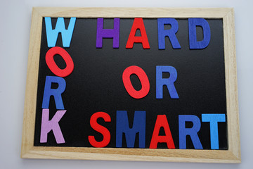 Work Hard or Work Smart Wording on Black Board