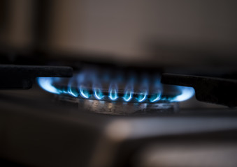 Gas burning from a kitchen gas stove. Selective focus.