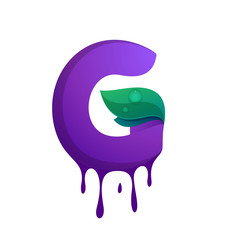 G letter with blueberry juice drops and leaves.