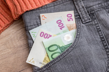 Jeans pocket full of euro money