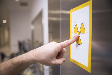 Radiation sign on door of operating room in a hospital
