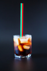 soft drinks. Cola glass with ice cubes on a white background