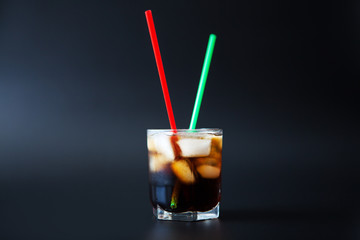 soft drinks. Cola glass with ice cubes on a white background