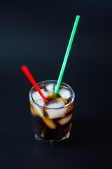 soft drinks. Cola glass with ice cubes on a white background