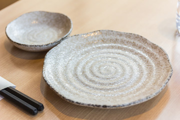 empty spiral pattern plate on wood table