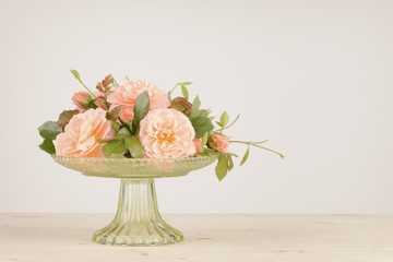 Rose arrangement with copy space, with photo filter applied.