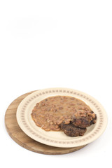 Meatballs with cooked beans on the plate