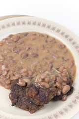 Meatballs with cooked beans on the plate