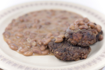 Meatballs with cooked beans on the plate
