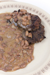 Cooked beans with meatballs served on the plate