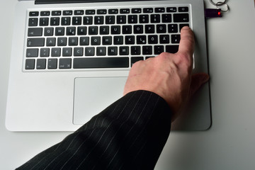 typing on laptop computer