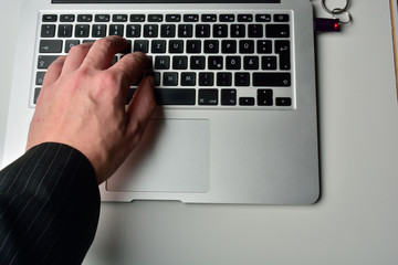 typing on laptop computer