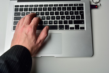 typing on laptop computer