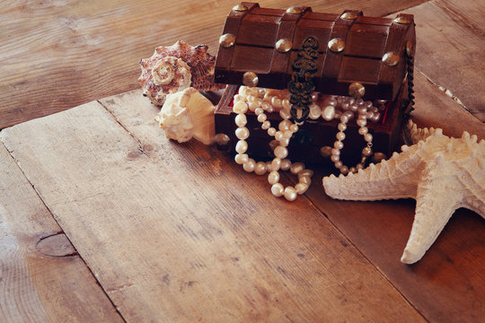 image of white pearls necklace in treasure chest