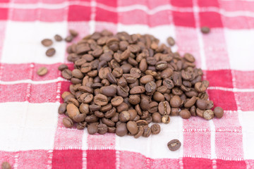Coffee beans background on the kitchen table cloth