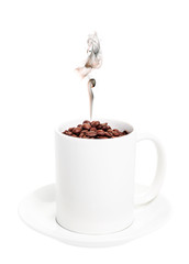 White cup with coffee beans smoke from them in the form of funny faces. Objects on a white background