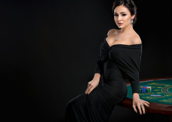 sexy woman with poker cards and chips