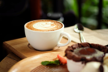 Hot coffee on a wooden  table.