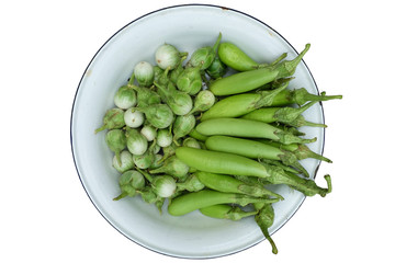 Eggplants in bowl on white background