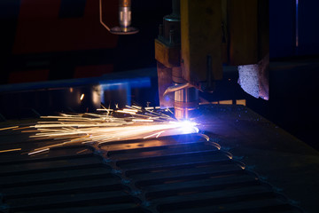 Metal sparks. Industrial laser cutting of metal