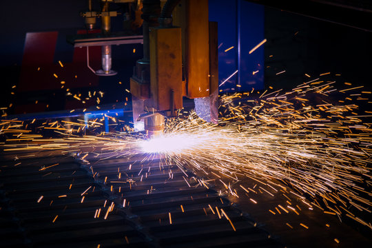 Metal sparks. Industrial laser cutting of metal