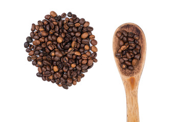 Spread coffee seeds and spoon on a white background