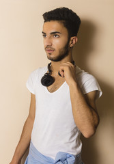 Studio shot of Brunette boy with white T-shirt 