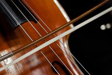  The fiddlestick on the strings of the cello closeup