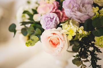 Tender interior with flower bouquet in a morning. Shabby style in a bedroom