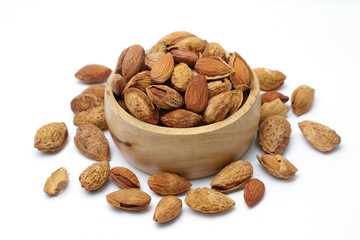 Group of almond nuts isolated on a white background.