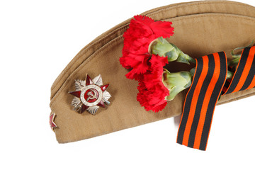 Carnation flowers, George Ribbon, forage cap, orders and medals. illustrative editorial.